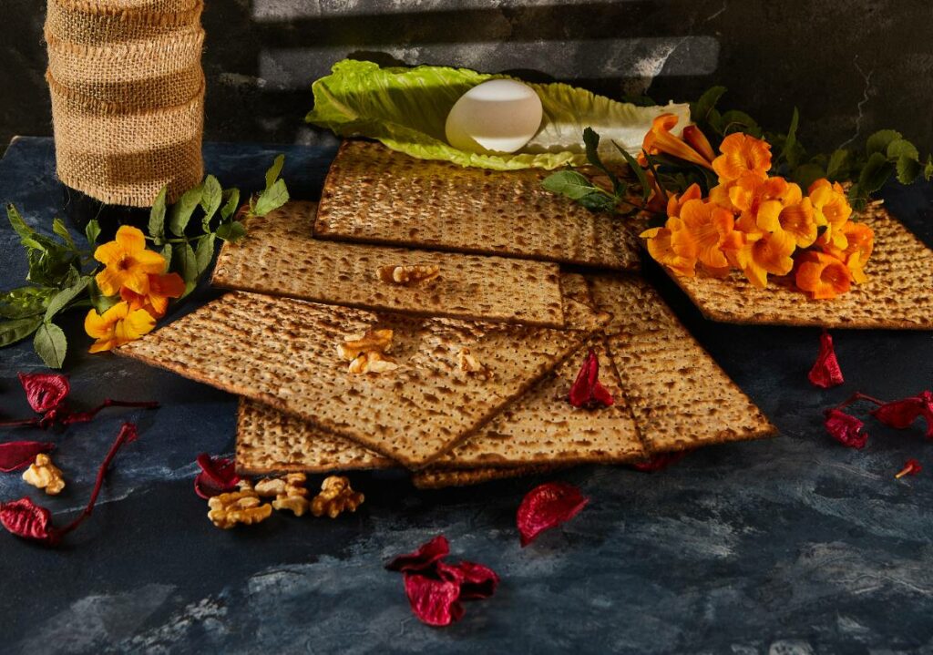 stack-of-matzah-with-flowers-and-nuts-as-finger-fo-2024-04-08-21-11-19-utc