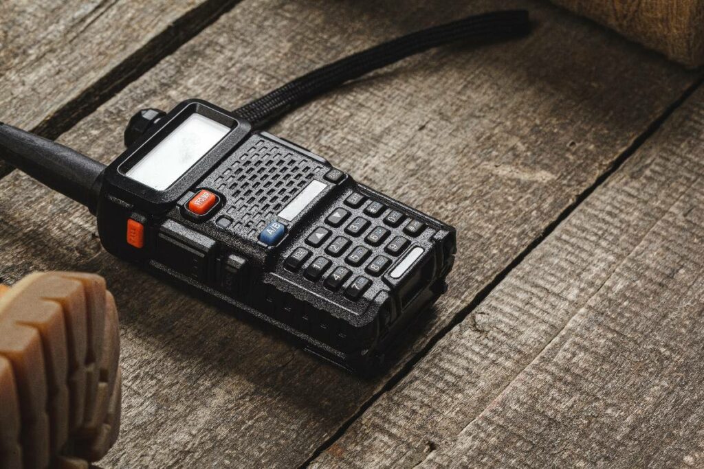 walkie-talkie-radio-set-on-wooden-table-close-up-2023-11-27-05-17-18-utc